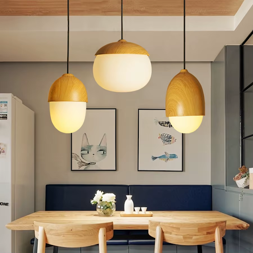 Nature-inspired chandelier featuring acorn, mushroom, and pine cone-shaped pendant lights in a cozy home setting.