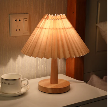 Modern LED table lamp with dimmable warm light on a nightstand