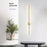 Modern wall-mounted light fixture in a minimalistic room with a plant and table.