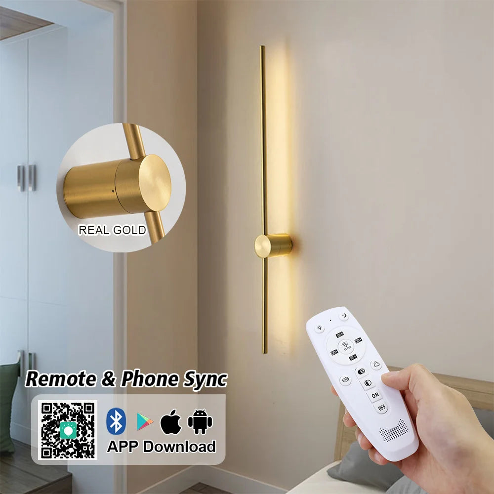 Gold wall light fixture with remote control and smartphone app compatibility.