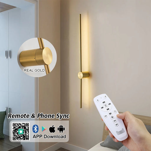 Gold wall light fixture with remote control and smartphone app compatibility.