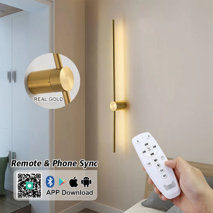 Gold wall light fixture with remote control and smartphone app compatibility.