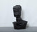 Handcrafted resin sculpture featuring an abstract character design