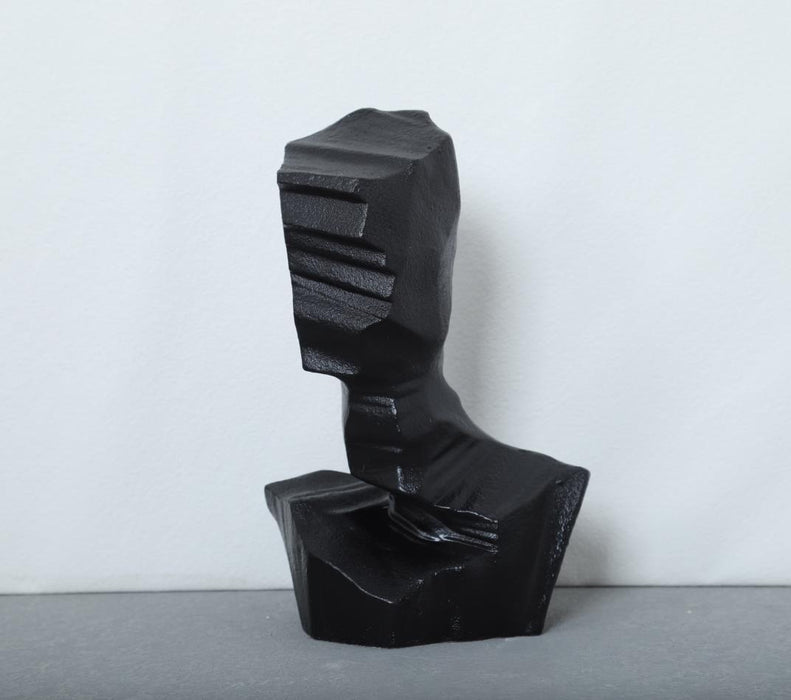 Handcrafted resin sculpture featuring an abstract character design